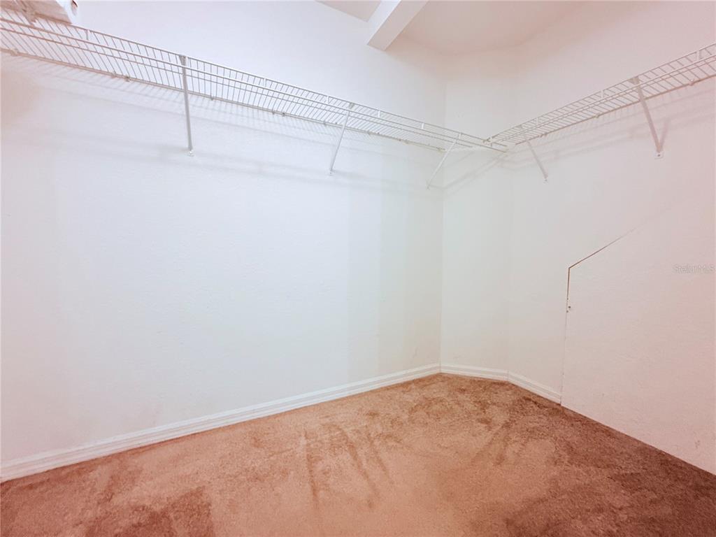 100 Turpial Way, Unit 107 Melbourne, FL 32901 - Photo 9 of 16 a view of a room with racks on the wall