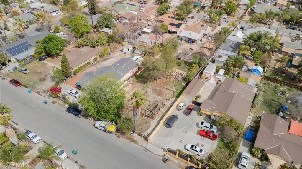 3957 South Neece Street Corona, CA 92879 - Photo 15 of 23 an aerial view of a house with a yard and parking