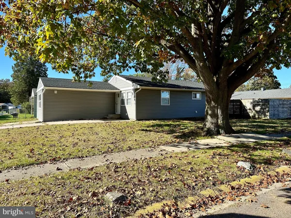 a view of a house with a tree