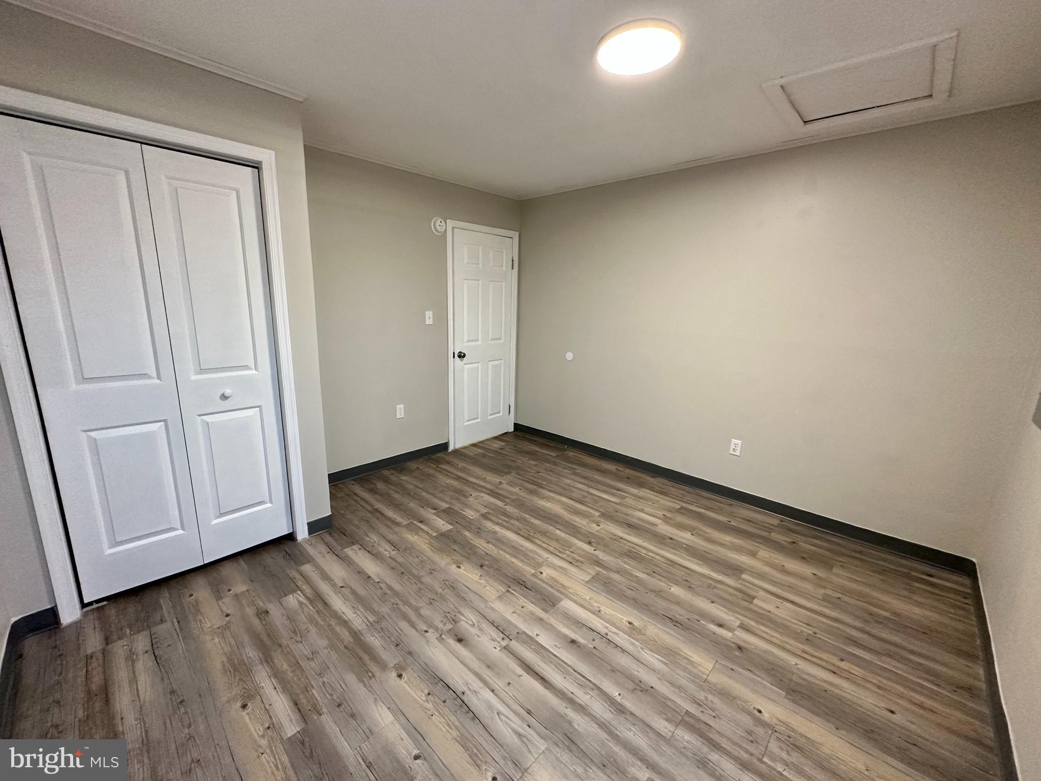 749 River Road Dover, DE 19901 - Photo 15 of 19 a view of an empty room with wooden floor and closet