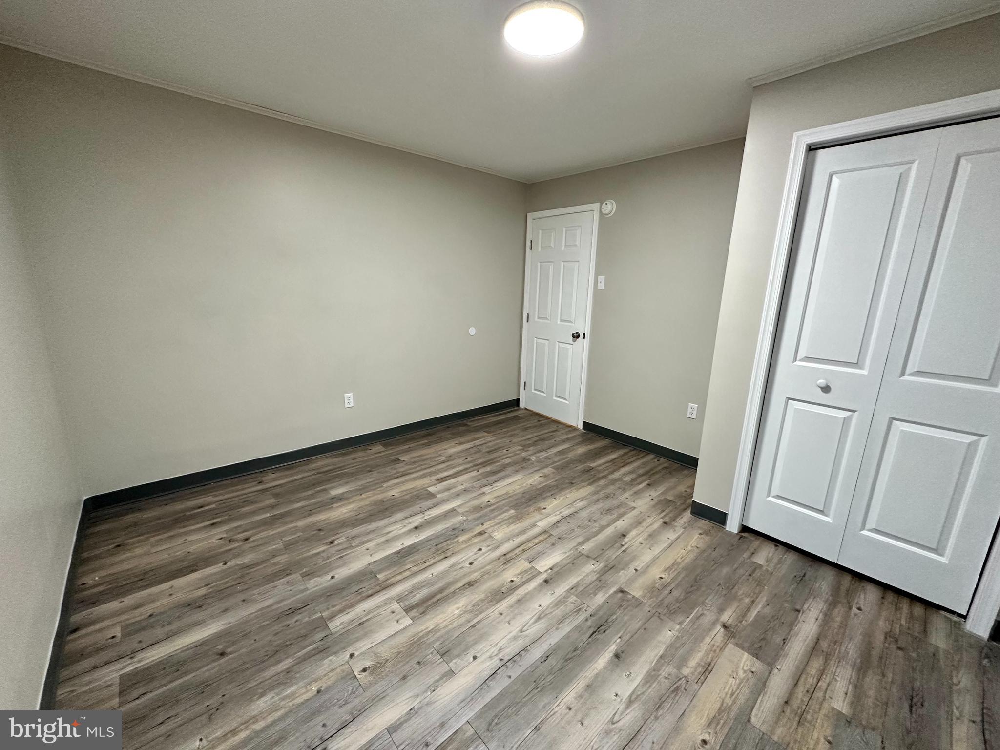 749 River Road Dover, DE 19901 - Photo 18 of 19 a view of wooden floor and windows in a room
