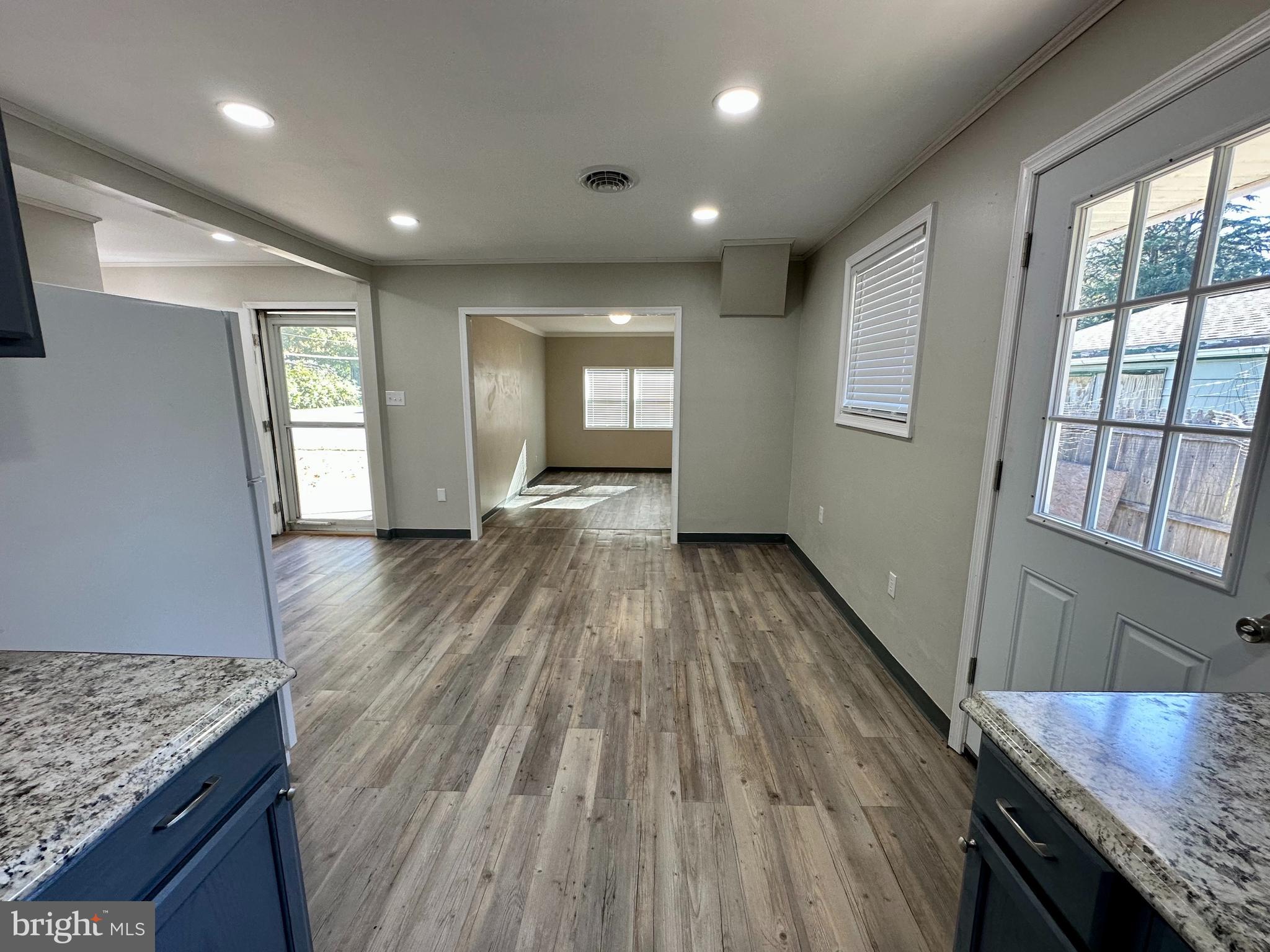 749 River Road Dover, DE 19901 - Photo 4 of 19 a view of a room with wooden floor and staircase