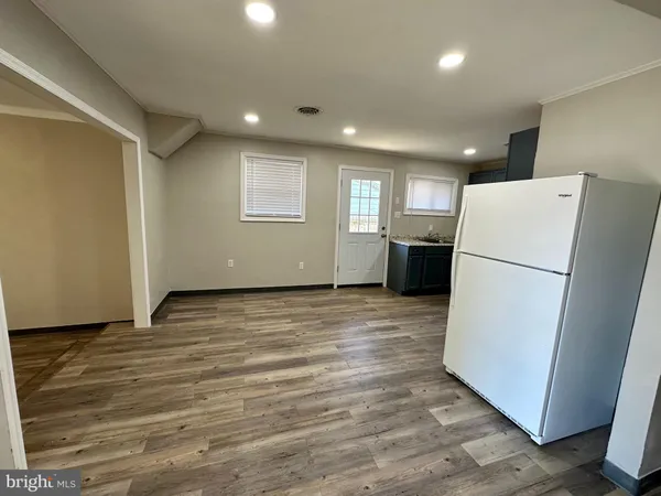 a view of kitchen and wooden floor