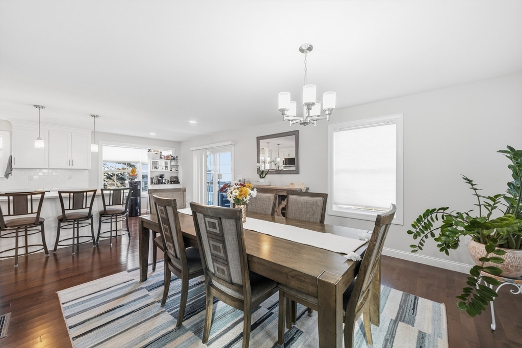 12 Sutton Street Peabody, MA 01960 - Photo 14 of 32 a view of a dining room with furniture and wooden floor