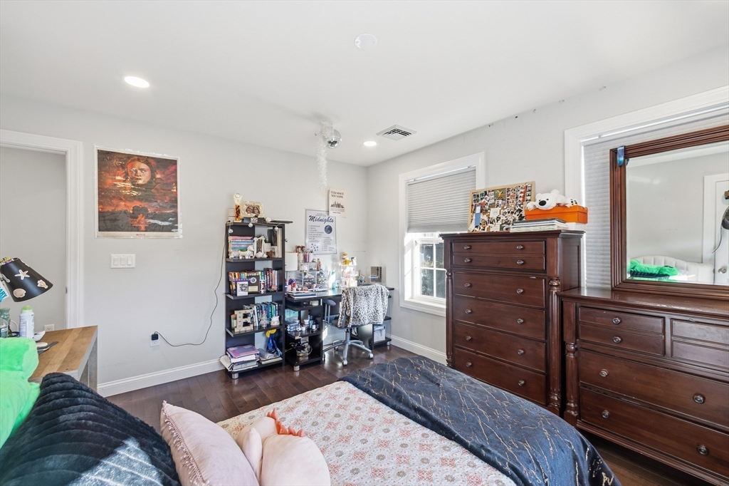 12 Sutton Street Peabody, MA 01960 - Photo 22 of 32 a bedroom with a bed and furniture