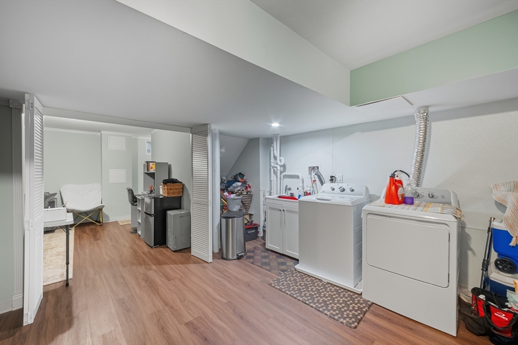 12 Sutton Street Peabody, MA 01960 - Photo 31 of 32 a storage room with furniture and a flat screen tv
