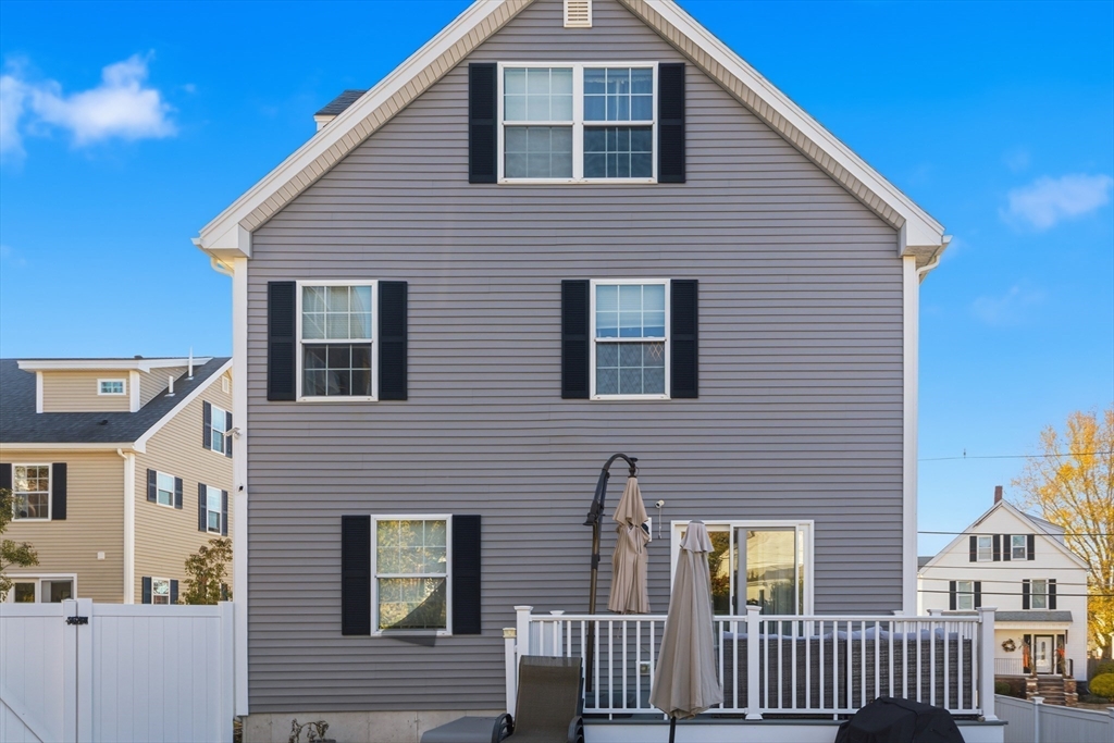12 Sutton Street Peabody, MA 01960 - Photo 5 of 32 a front view of a house with a porch