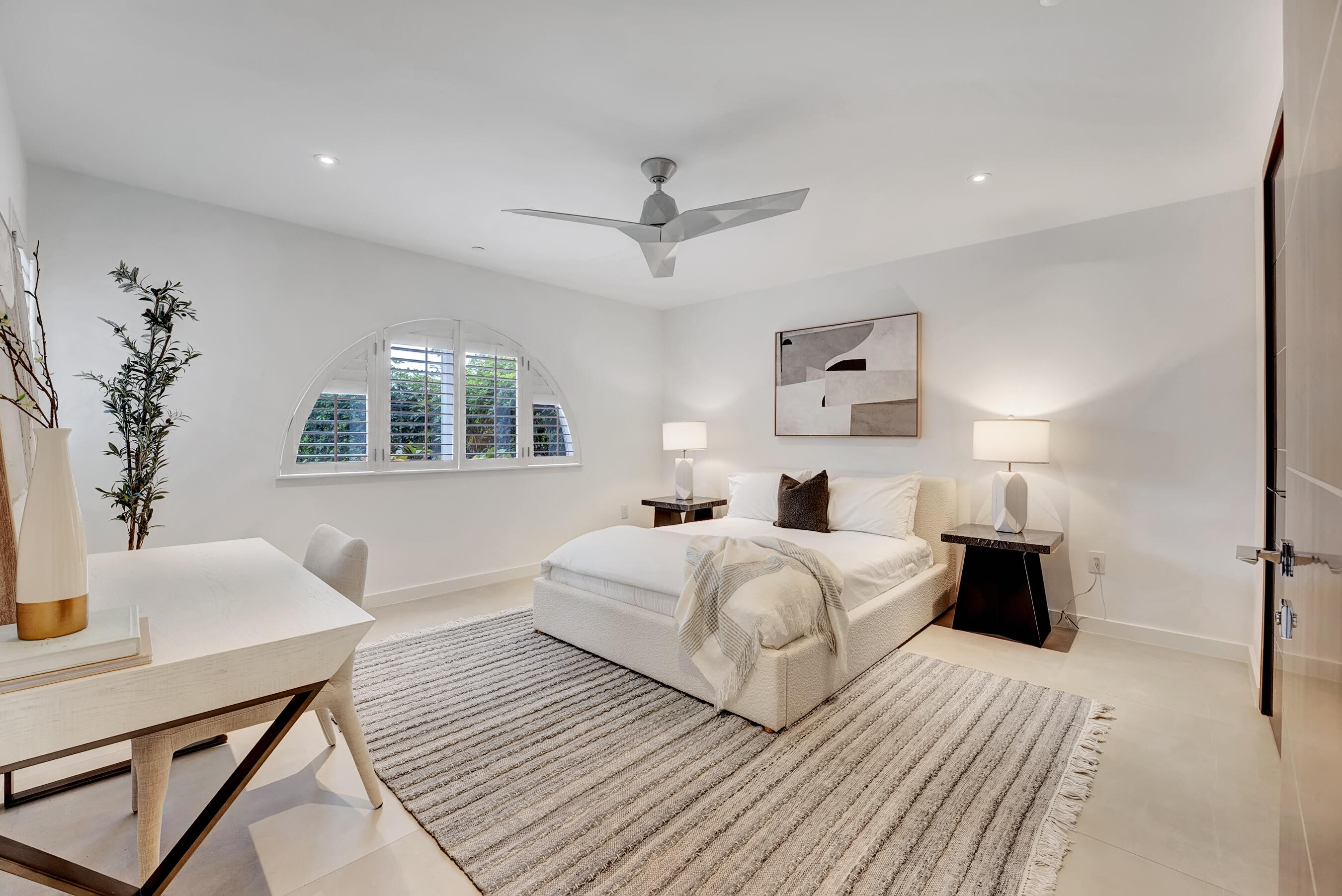 462 East Boca Raton Road Boca Raton, FL 33432 - Photo 18 of 43 a bedroom with a large bed and a table