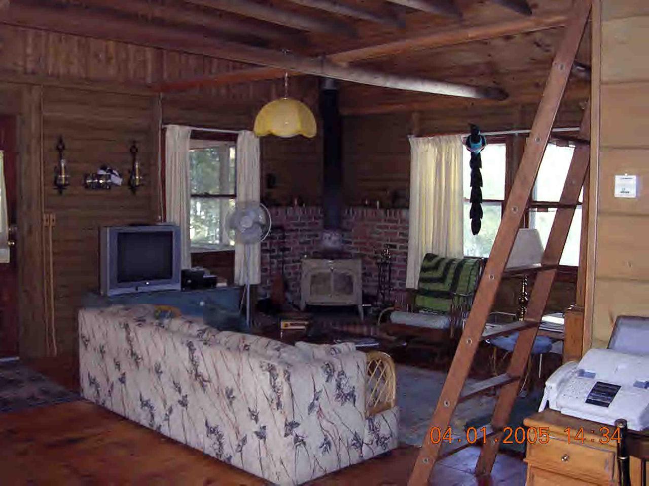 8 Hayre Island Road Otis, MA 01029 - Photo 4 of 6 a living room with fireplace furniture and a wooden floor