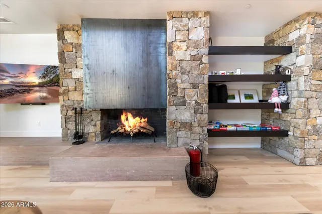 a room with fireplace and furniture