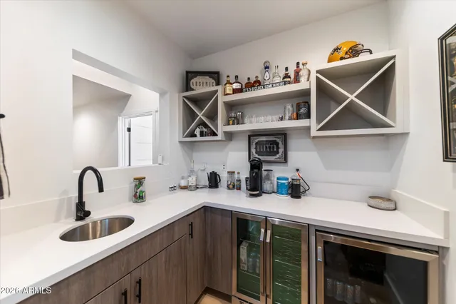 a kitchen with a sink a cabinets and window