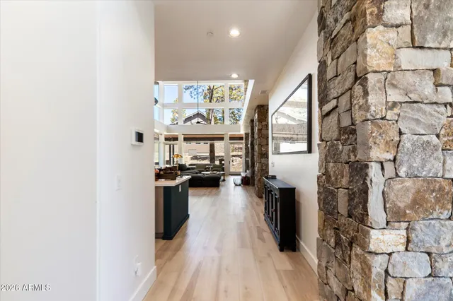 a kitchen with stainless steel appliances a stove top oven and a chimney