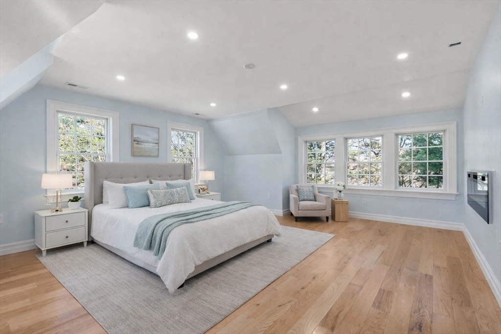10 Hitching Post Lane Weston, MA 02493 - Photo 28 of 42 a spacious bedroom with a large bed and windows
