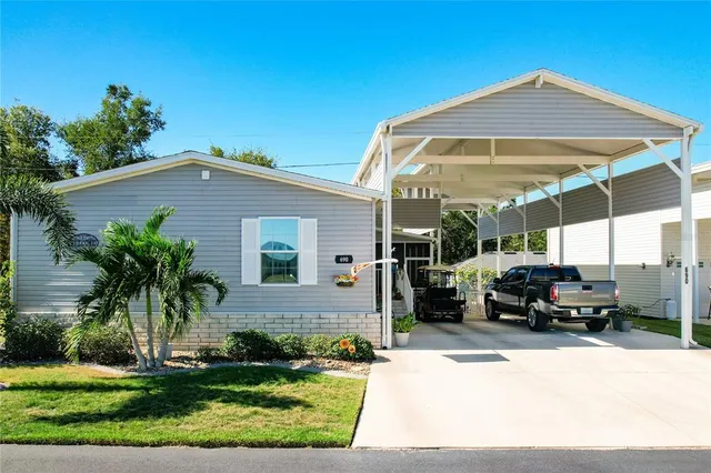 a car parked in front of white house