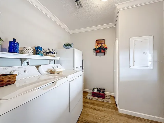 a living room with baby bed furniture and decor