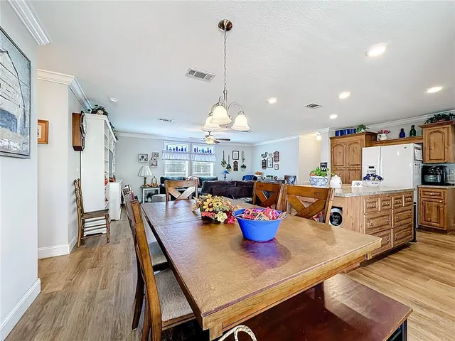 a very nice looking dining room with a table and chairs