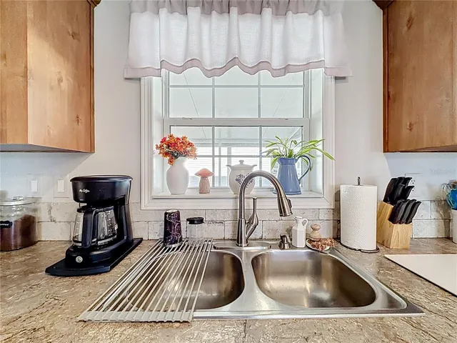 a kitchen with a sink and a stove