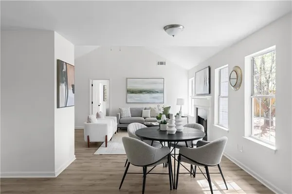 a dining room with furniture and window