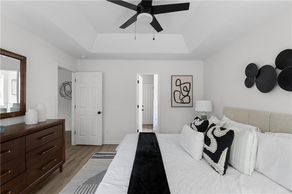 2203 Hidden Creek Drive Decatur, GA 30035 - Photo 17 of 24 a bedroom with a bed and wooden floor