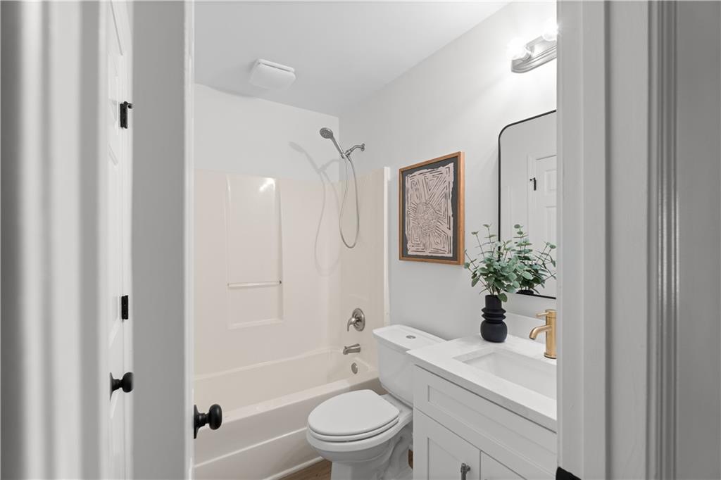 2203 Hidden Creek Drive Decatur, GA 30035 - Photo 20 of 24 a bathroom with a sink a toilet and shower