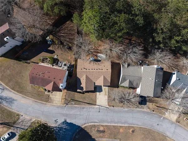 an aerial view of a house with outdoor space