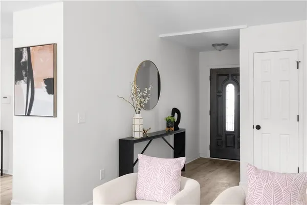 a view of a livingroom with furniture and entryway