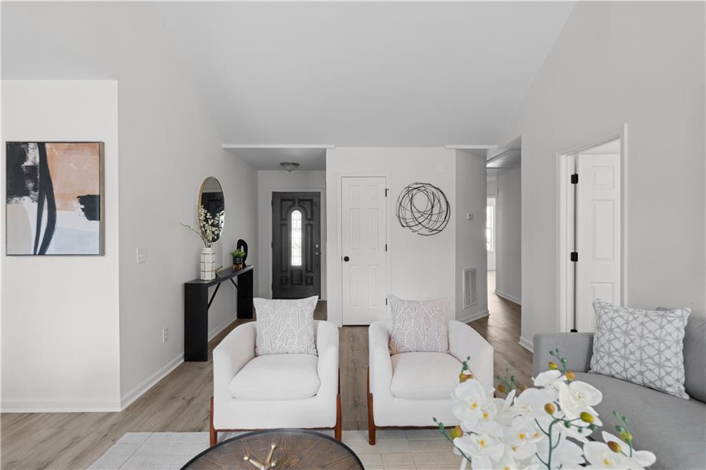 2203 Hidden Creek Drive Decatur, GA 30035 - Photo 4 of 24 a living room with furniture and a clock
