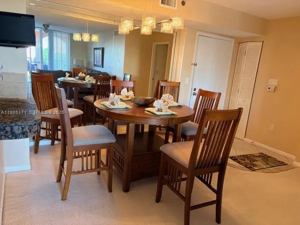 a view of a dining room with furniture