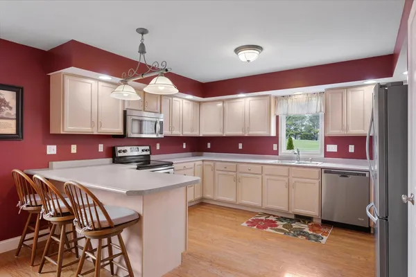 an aerial view of a house with a lake view