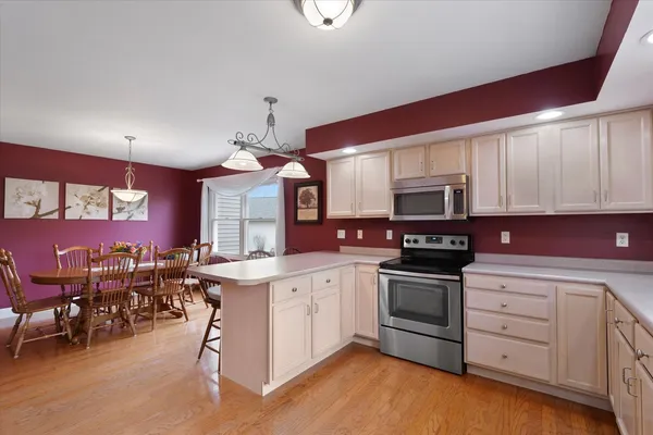 a picture of a room with a white wall and a picture