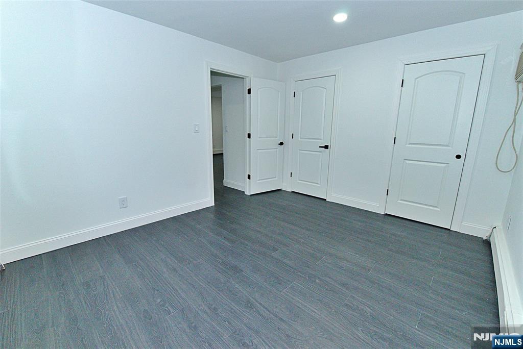 401 Undercliff Avenue Edgewater, NJ 07020 - Photo 15 of 50 a view of an empty room with wooden floor