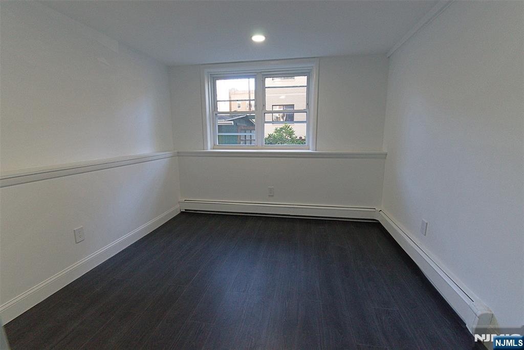 401 Undercliff Avenue Edgewater, NJ 07020 - Photo 22 of 50 a view of a small space with wooden floor and a window