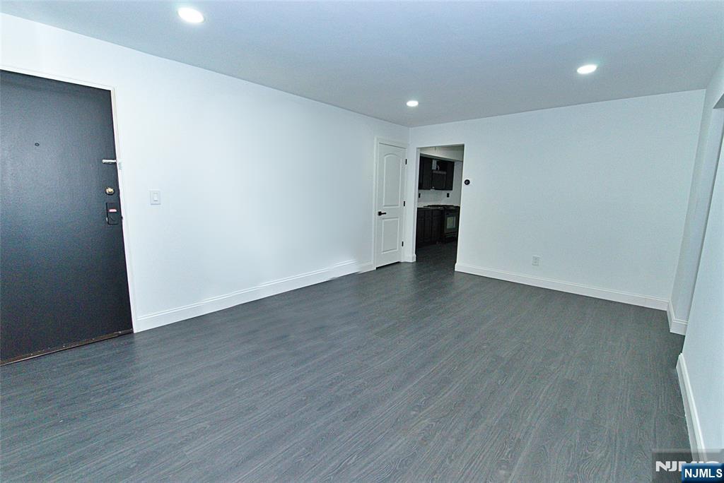 401 Undercliff Avenue Edgewater, NJ 07020 - Photo 3 of 50 a view of an empty room with wooden floor and closet