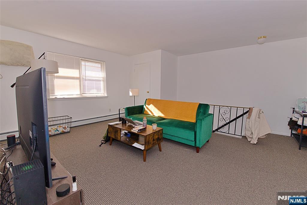 401 Undercliff Avenue Edgewater, NJ 07020 - Photo 32 of 50 a bedroom with furniture and a window