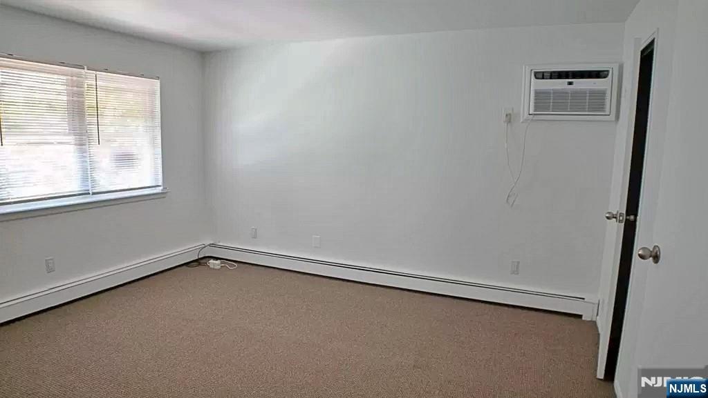 401 Undercliff Avenue Edgewater, NJ 07020 - Photo 36 of 50 an empty room with a window
