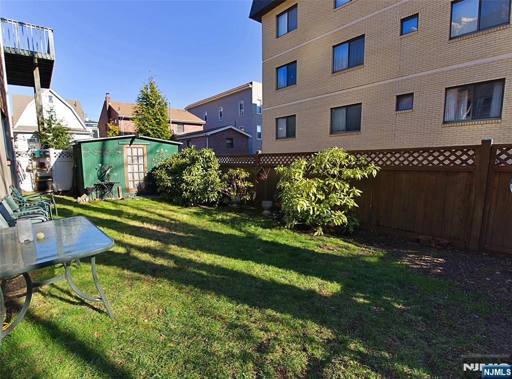 401 Undercliff Avenue Edgewater, NJ 07020 - Photo 48 of 50 a view of a house with a yard