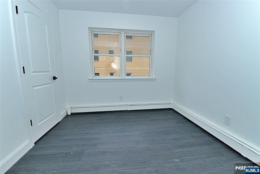 401 Undercliff Avenue Edgewater, NJ 07020 - Photo 10 of 50 a view of a small space with wooden floor and a window