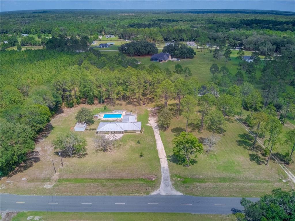 7422 County Road 231 Lake Butler, FL 32054 - Photo 56 of 57 a view of a yard with large trees