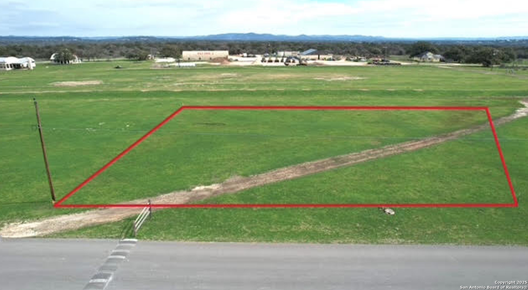 a view of a field with a big yard