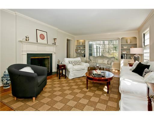 122 Colony Road Darien, CT 06820 - Photo 3 of 19 a living room with furniture a fireplace and large windows