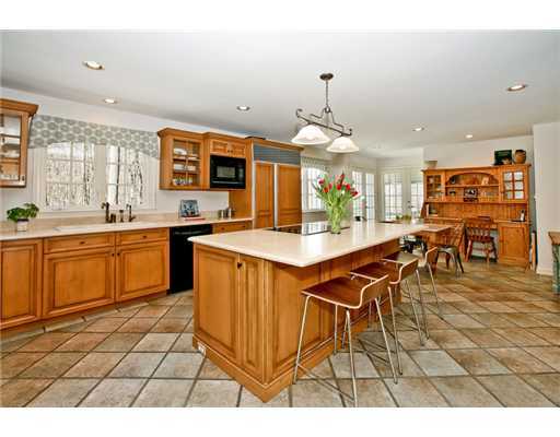122 Colony Road Darien, CT 06820 - Photo 7 of 19 a open kitchen with stainless steel appliances kitchen island granite countertop a sink and cabinets