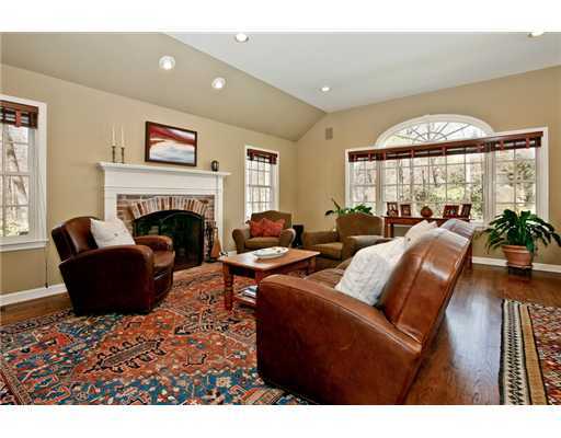 122 Colony Road Darien, CT 06820 - Photo 8 of 19 a living room with furniture fireplace and a large window