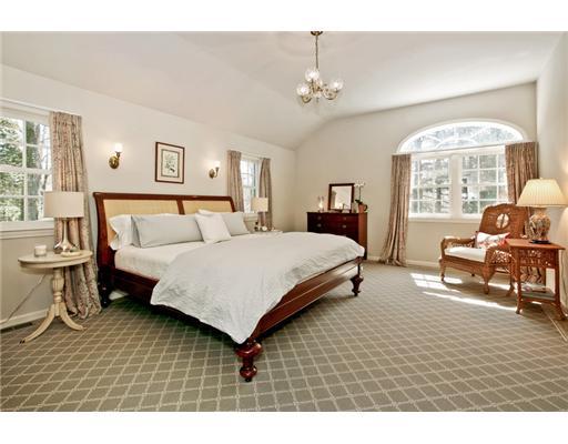 122 Colony Road Darien, CT 06820 - Photo 10 of 19 a bedroom with a bed a table and chair