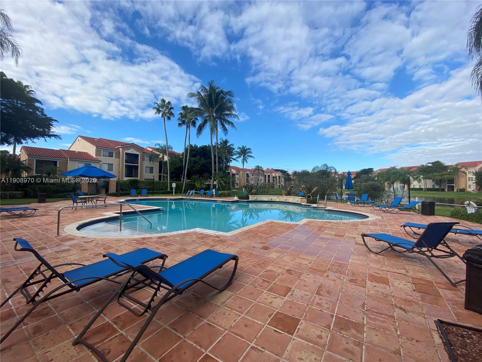 2173 Renaissance Boulevard, Unit 105 Miramar, FL 33025 - Photo 13 of 16 a view of swimming pool with seating area and furniture