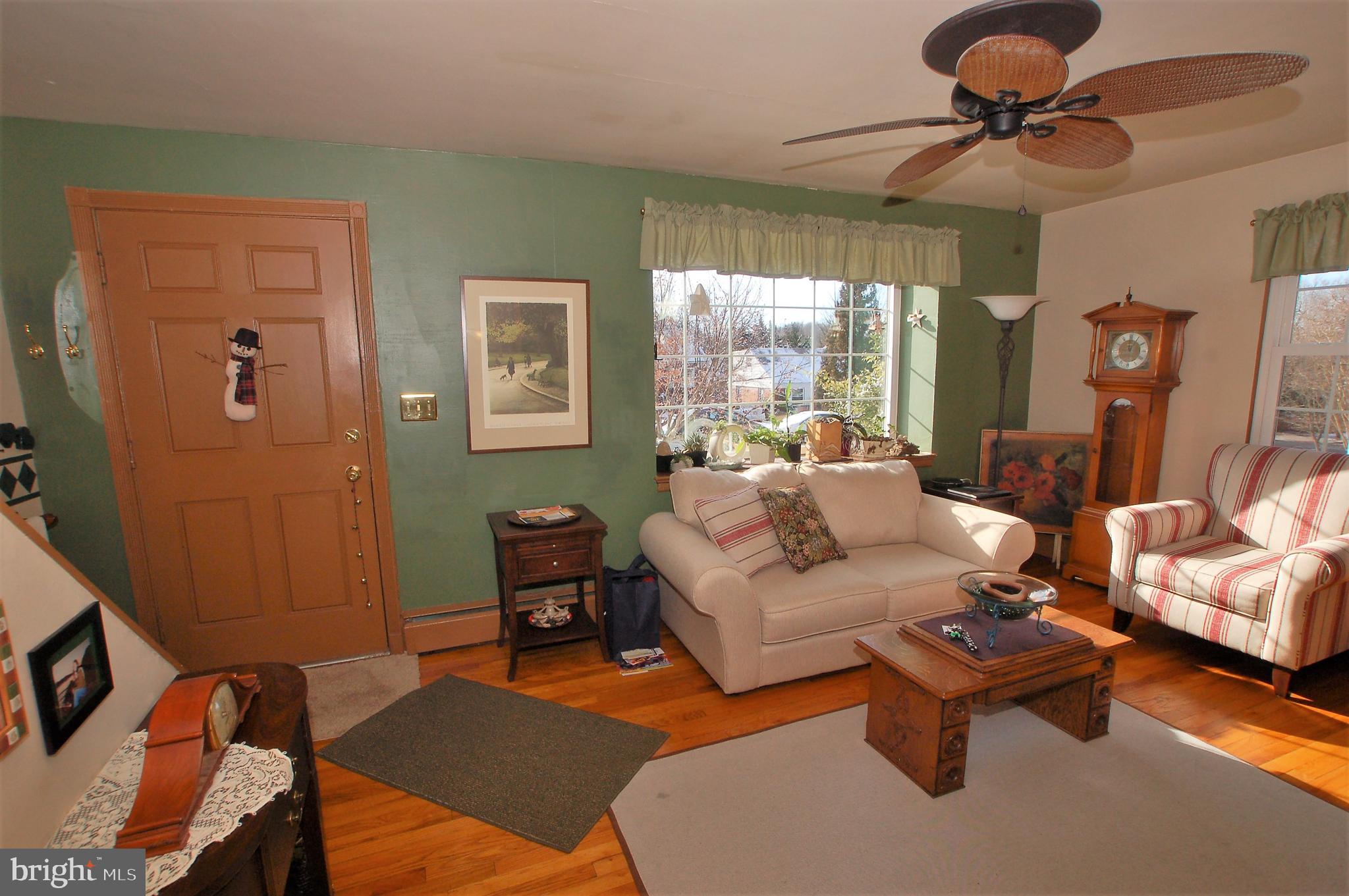 1005 Kingston Road Baltimore, MD 21208 - Photo 2 of 45 a living room with furniture and a chandelier