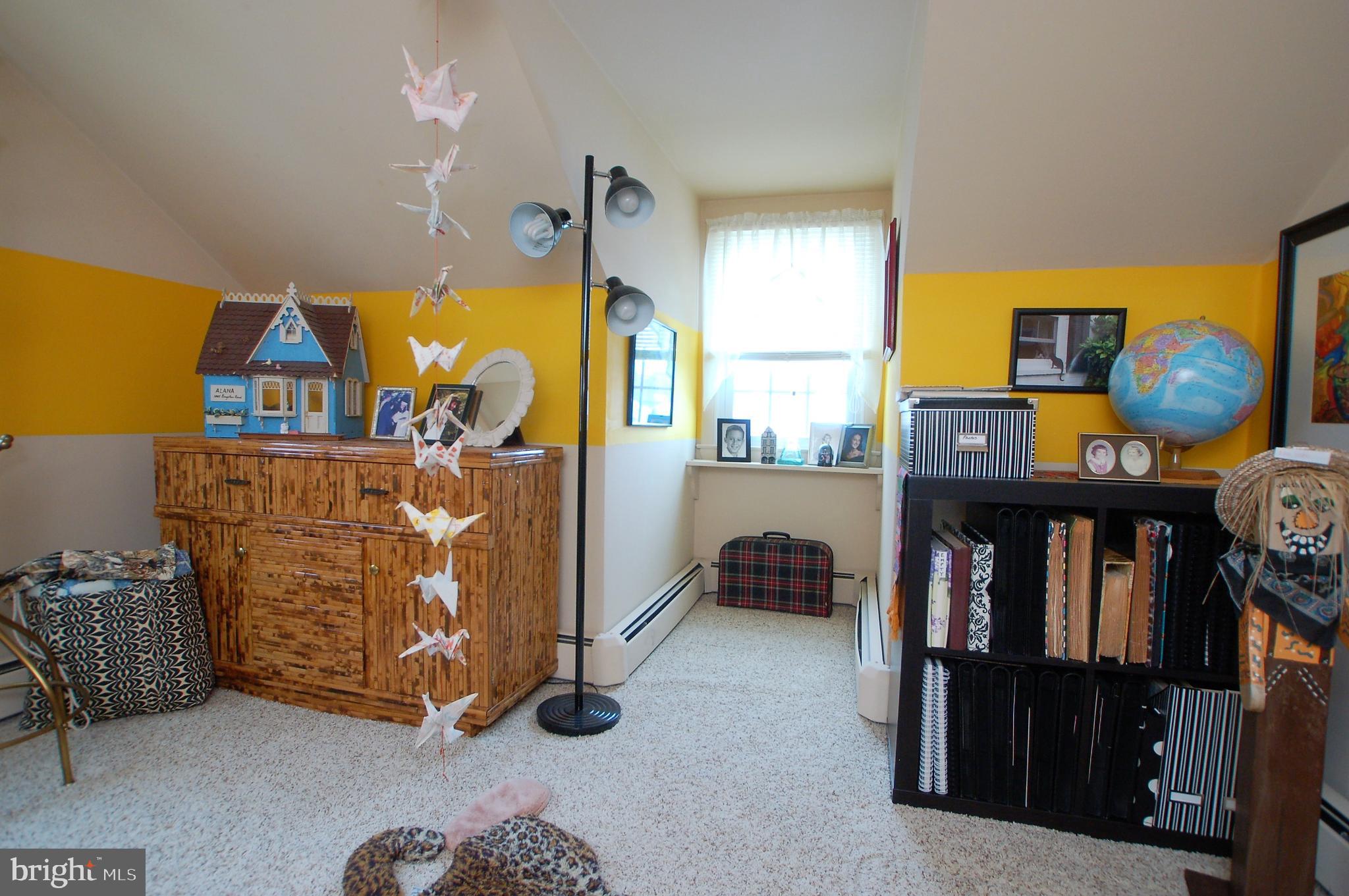 1005 Kingston Road Baltimore, MD 21208 - Photo 20 of 45 a bedroom with furniture and a window