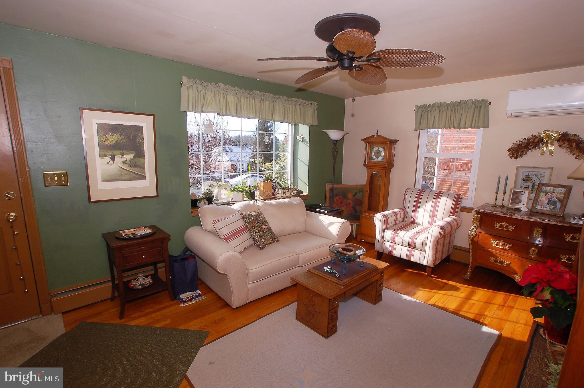 1005 Kingston Road Baltimore, MD 21208 - Photo 3 of 45 a living room with furniture and a large window