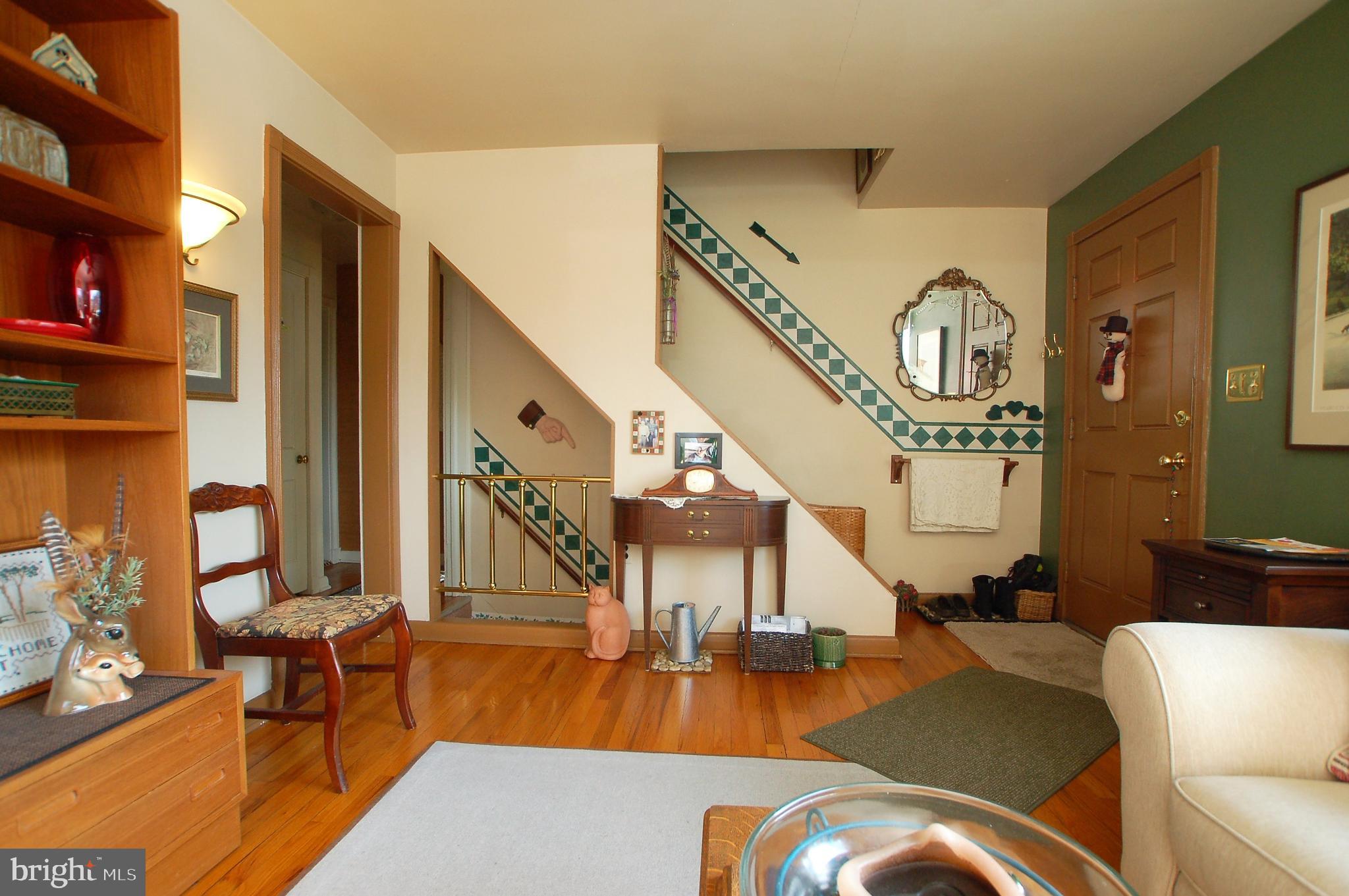 1005 Kingston Road Baltimore, MD 21208 - Photo 5 of 45 a view of a livingroom with furniture staircase and a living room