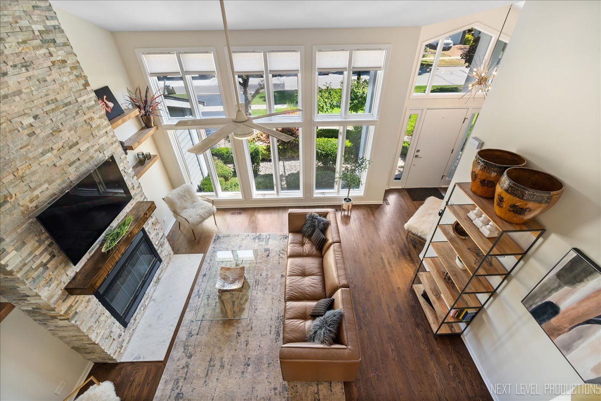 710 Hampton Course West Chicago, IL 60185 - Photo 22 of 28 a living room with furniture and a flat screen tv