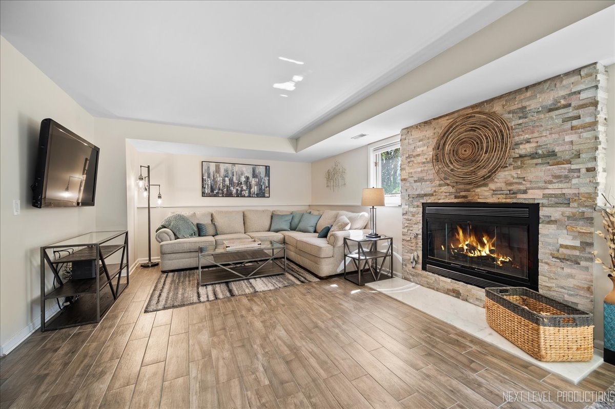 710 Hampton Course West Chicago, IL 60185 - Photo 23 of 28 a living room with furniture and a fireplace